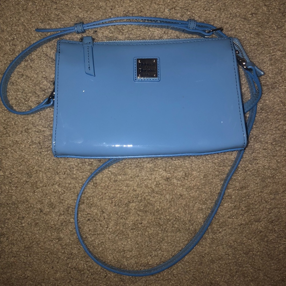 A blue shinny leather crossbody bag